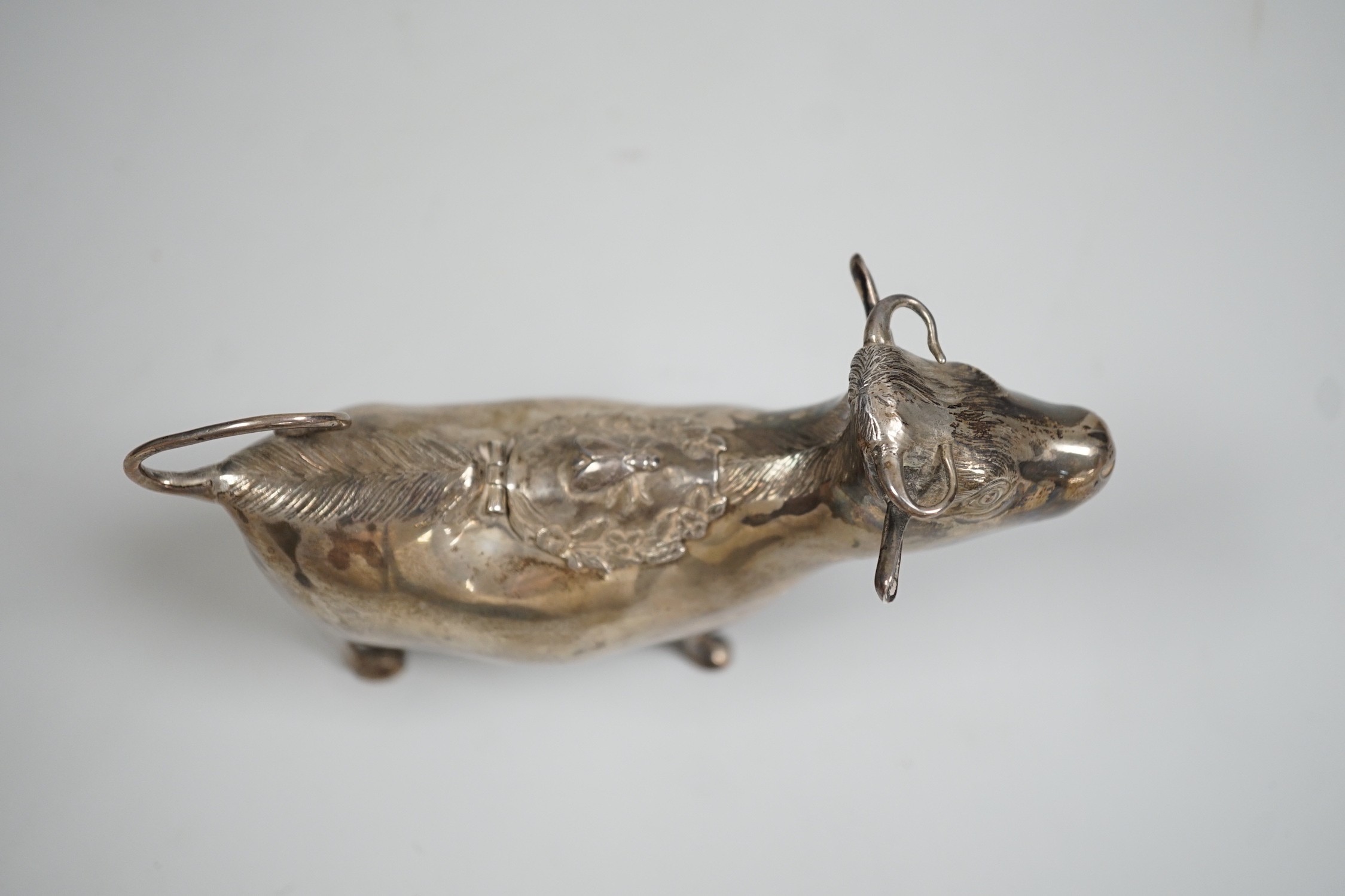 An Elizabeth II silver cow creamer, William Comyns & Sons Ltd, London, 1965, length 15cm, 152 grams.